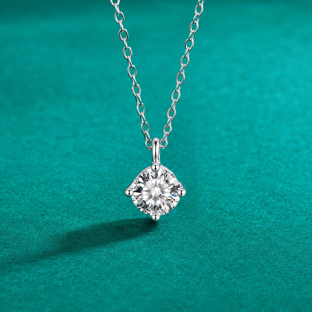 Four-Prong Round Moissanite Pendant Necklace in Gold-Plated S925 sterling silver close-up styled product scene showing pendant setting