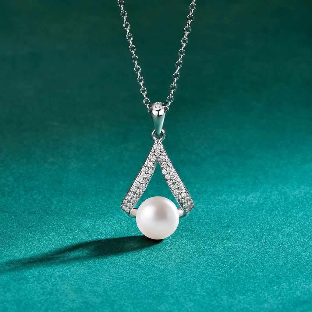 V-Shape Button Pearl Moissanite Necklace in Gold-Plated S925 sterling silver close-up styled product scene showing pendant setting