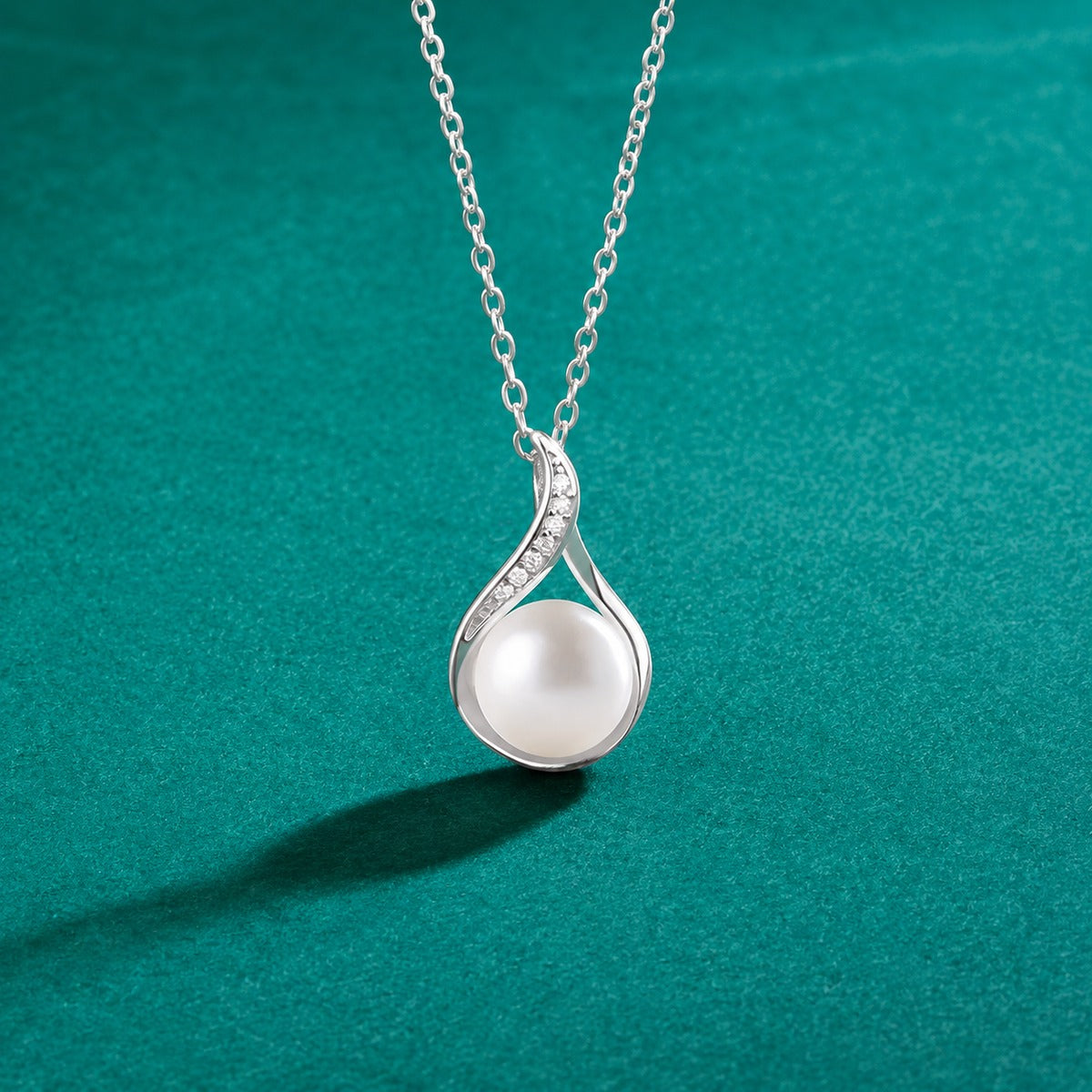Teardrop Pearl Round Moissanite Necklace in White Gold-Plated S925 sterling silver close-up styled product scene showing pendant setting