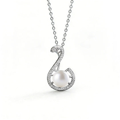 Treble Clef Pearl Round Moissanite Necklace in White Gold-Plated S925 sterling silver white background front product view showing treble clef pendant traced in round moissanite around a button pearl