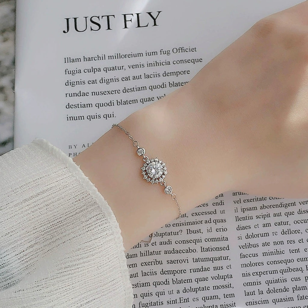 Sunflower Halo Round Moissanite Adjustable Bracelet with CZ in White Gold-Plated S925 Sterling Silver worn on the wrist showing bracelet scale, fit, and styling
