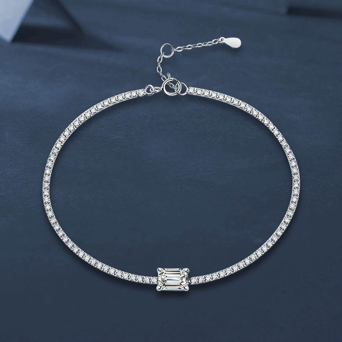 Emerald-Cut Moissanite Tennis Bracelet with CZ in White Gold-Plated S925 sterling silver angled product display showing bracelet silhouette