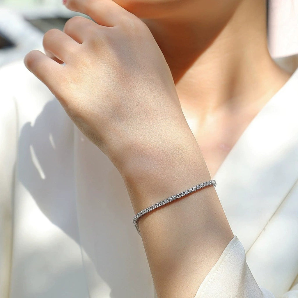 Round Moissanite Tennis Bracelet in White Gold-Plated S925 sterling silver worn on wrist model view showing scale and adjustable fit
