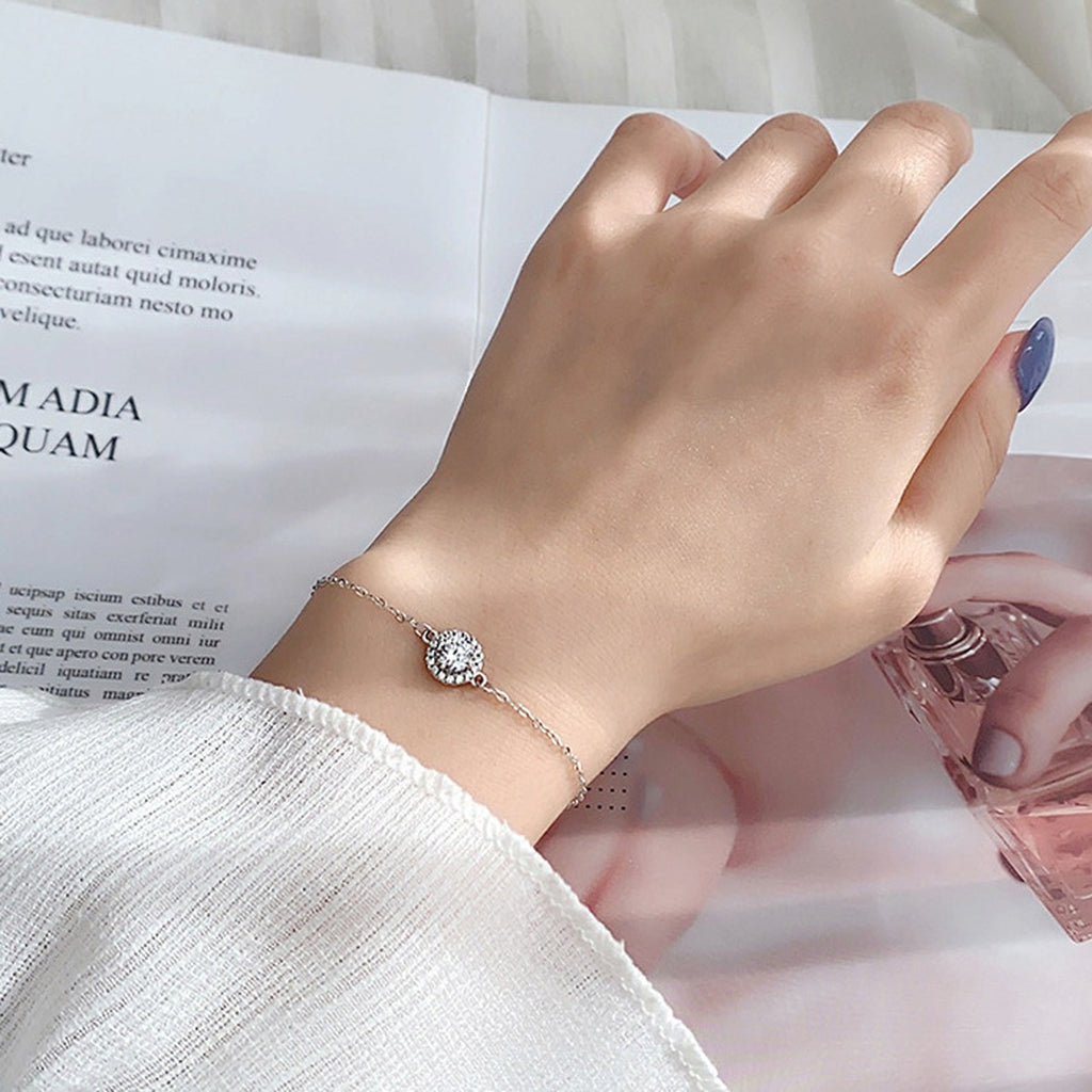 Round Halo Moissanite Adjustable Bracelet in White Gold-Plated S925 Sterling Silver worn on the wrist showing bracelet scale, fit, and styling