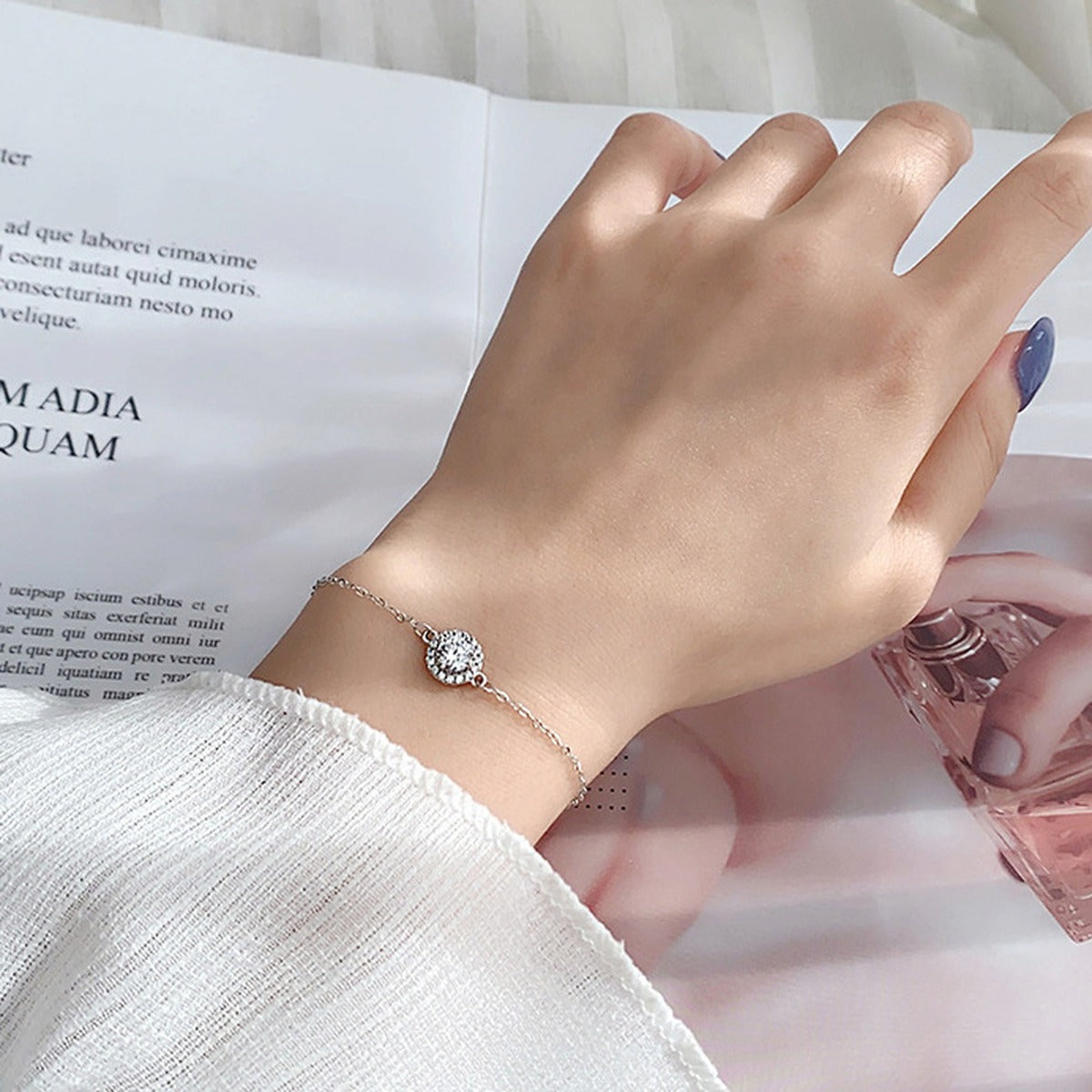 Round Halo Moissanite Adjustable Bracelet in White Gold-Plated S925 Sterling Silver worn on the wrist showing bracelet scale, fit, and styling