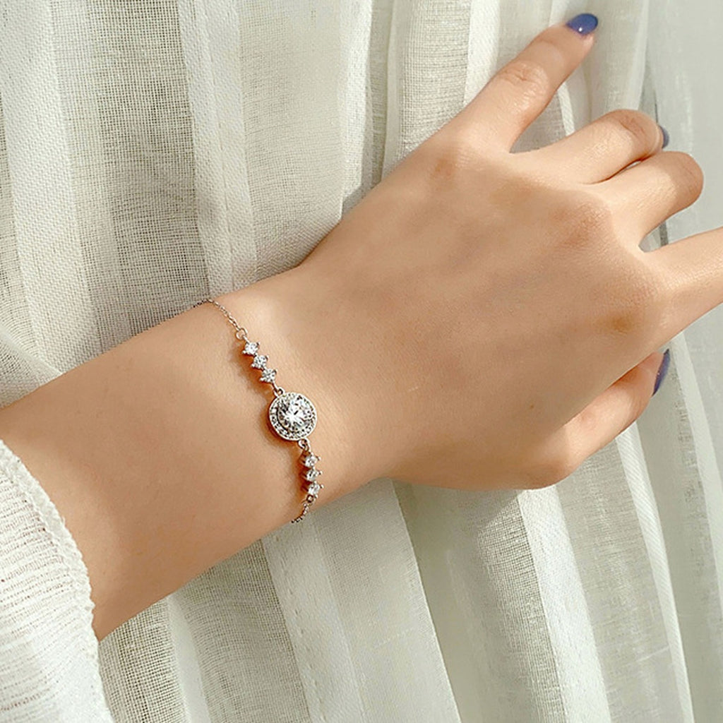 Round Halo Moissanite Adjustable Bracelet in Gold-Plated S925 Sterling Silver worn on the wrist showing bracelet scale, fit, and styling