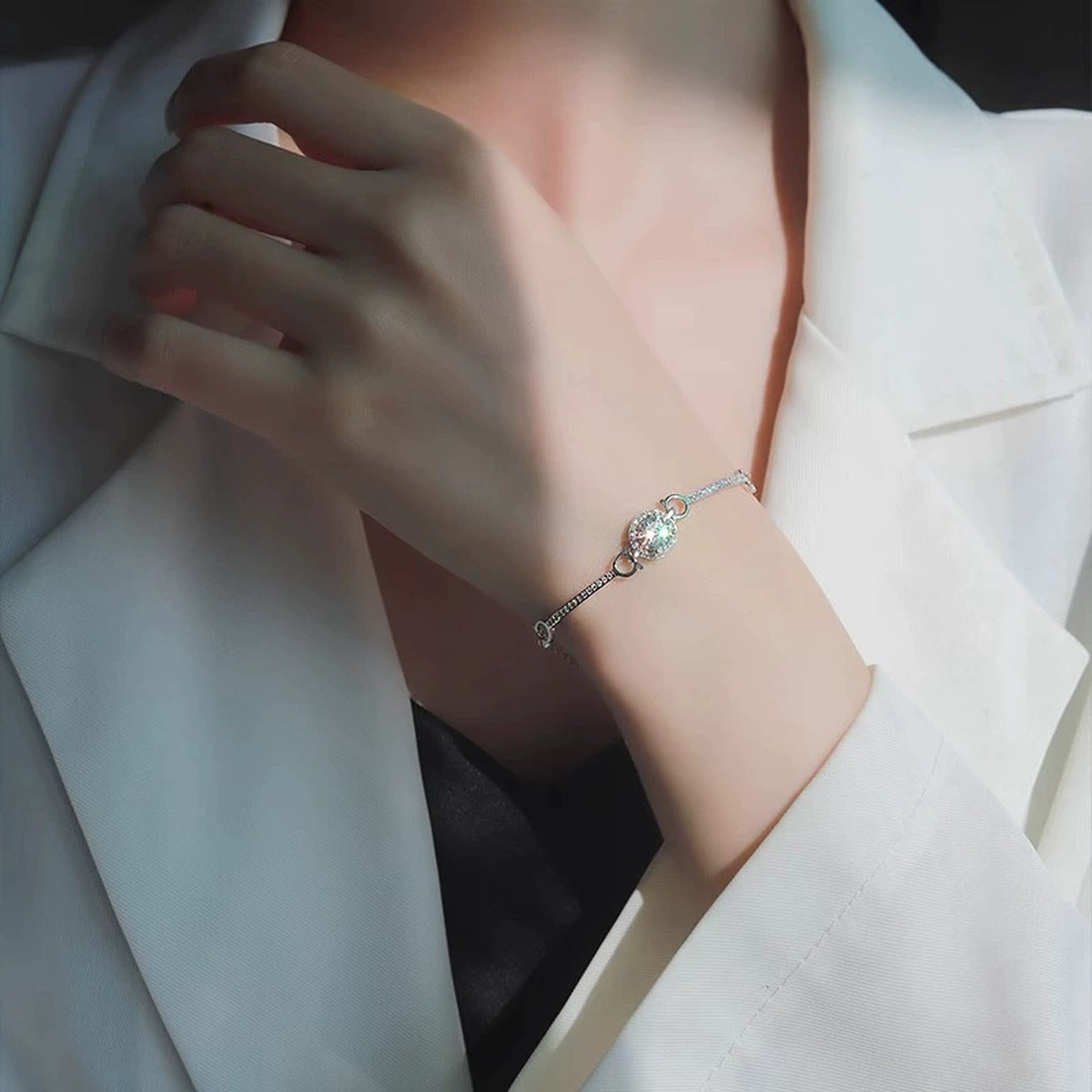 Round Halo Moissanite Bracelet with CZ in White Gold-Plated S925 sterling silver worn on wrist model view showing scale and adjustable fit