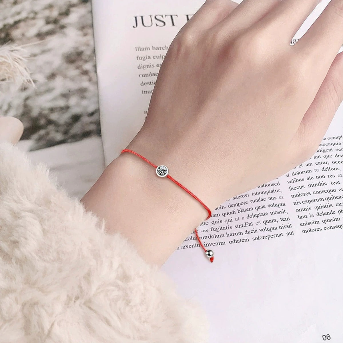 Round Moissanite Beaded Cord Bracelet in White Gold-Plated S925 sterling silver worn on wrist model view showing scale and adjustable fit