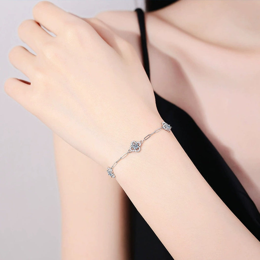 Three-Clover Round Moissanite Charm Bracelet with CZ in White Gold-Plated S925 sterling silver worn on wrist model view showing scale and adjustable fit