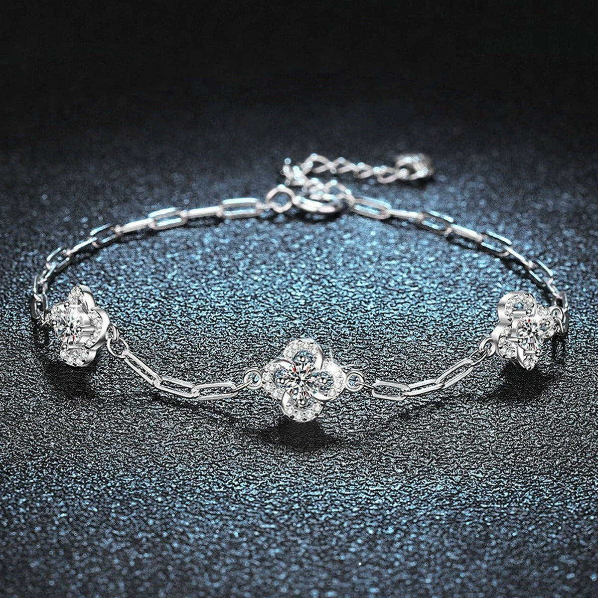 Three-Clover Round Moissanite Charm Bracelet with CZ in White Gold-Plated S925 sterling silver angled product display showing bracelet silhouette