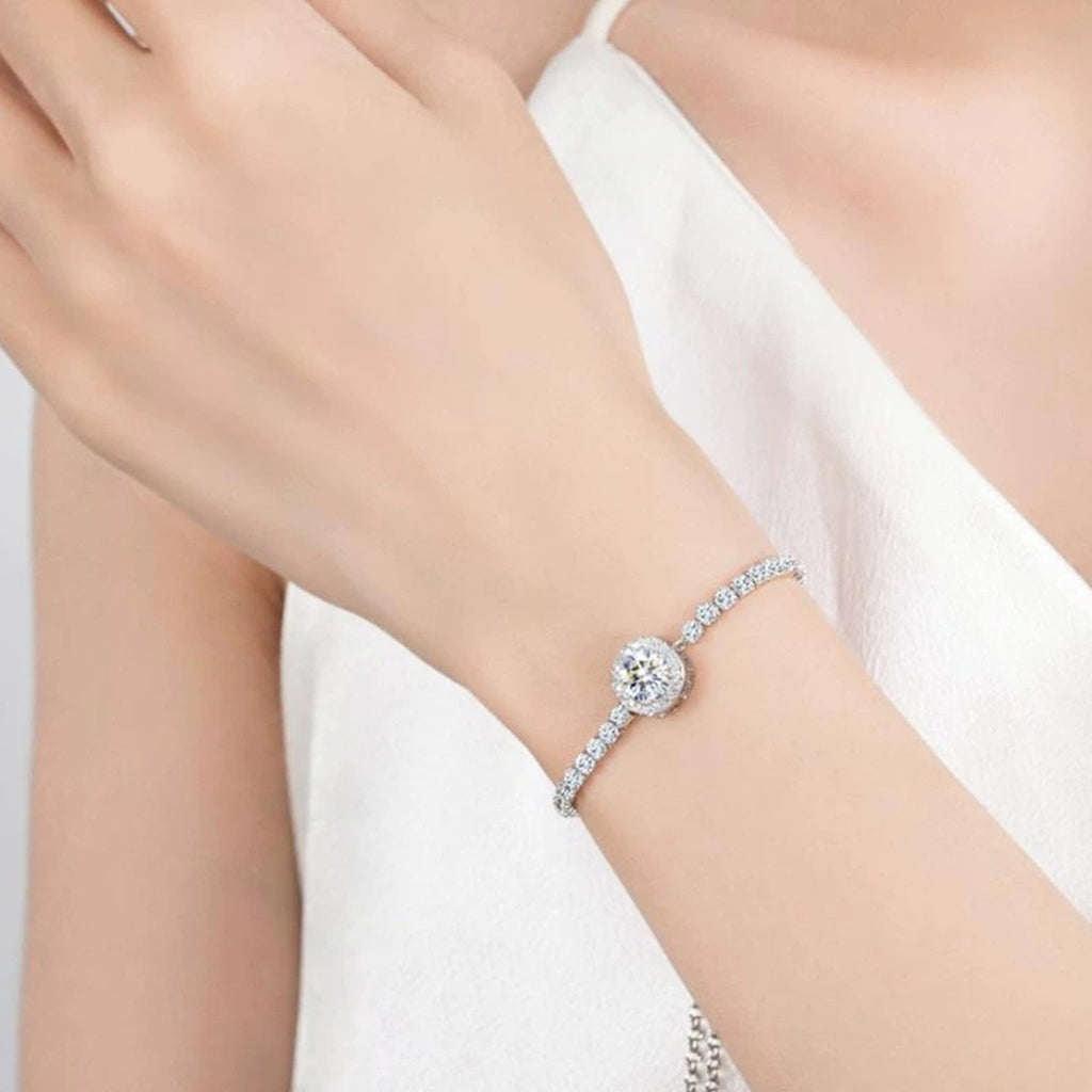 Round Moissanite Bolo Tennis Bracelet in White Gold-Plated S925 sterling silver worn on wrist model view showing scale and adjustable fit