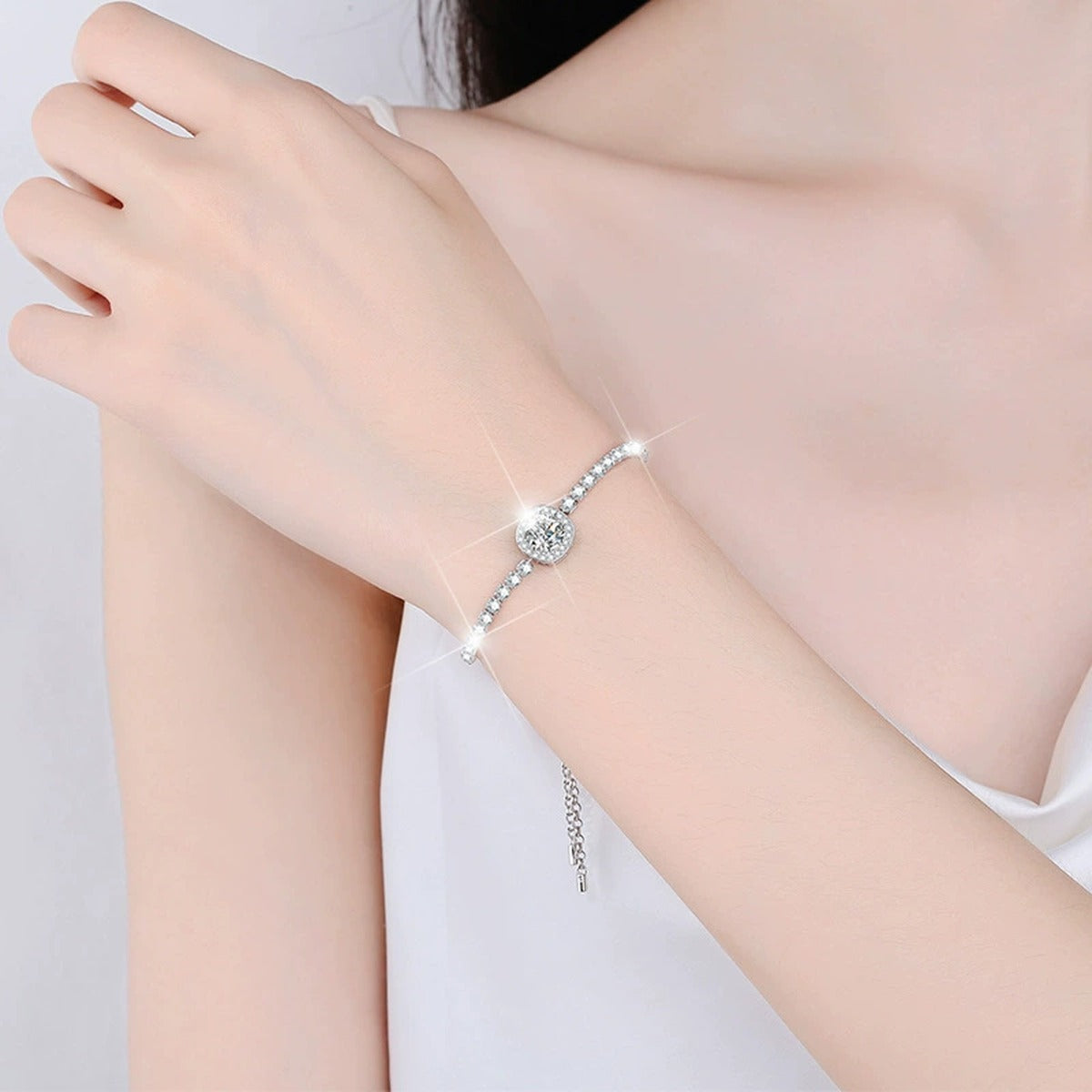 Round Halo Moissanite Bolo Tennis Bracelet with CZ in White Gold-Plated S925 sterling silver worn on wrist model view showing scale and adjustable fit