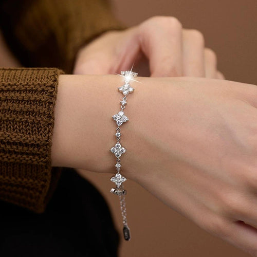 Clover Round Moissanite Charm Bracelet with CZ in Gold-Plated S925 sterling silver worn on wrist model view showing scale and adjustable fit