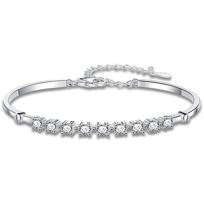 Graduated Round Moissanite Bangle Bracelet in White Gold-Plated S925 sterling silver white background product photo showing bracelet shape and moissanite setting