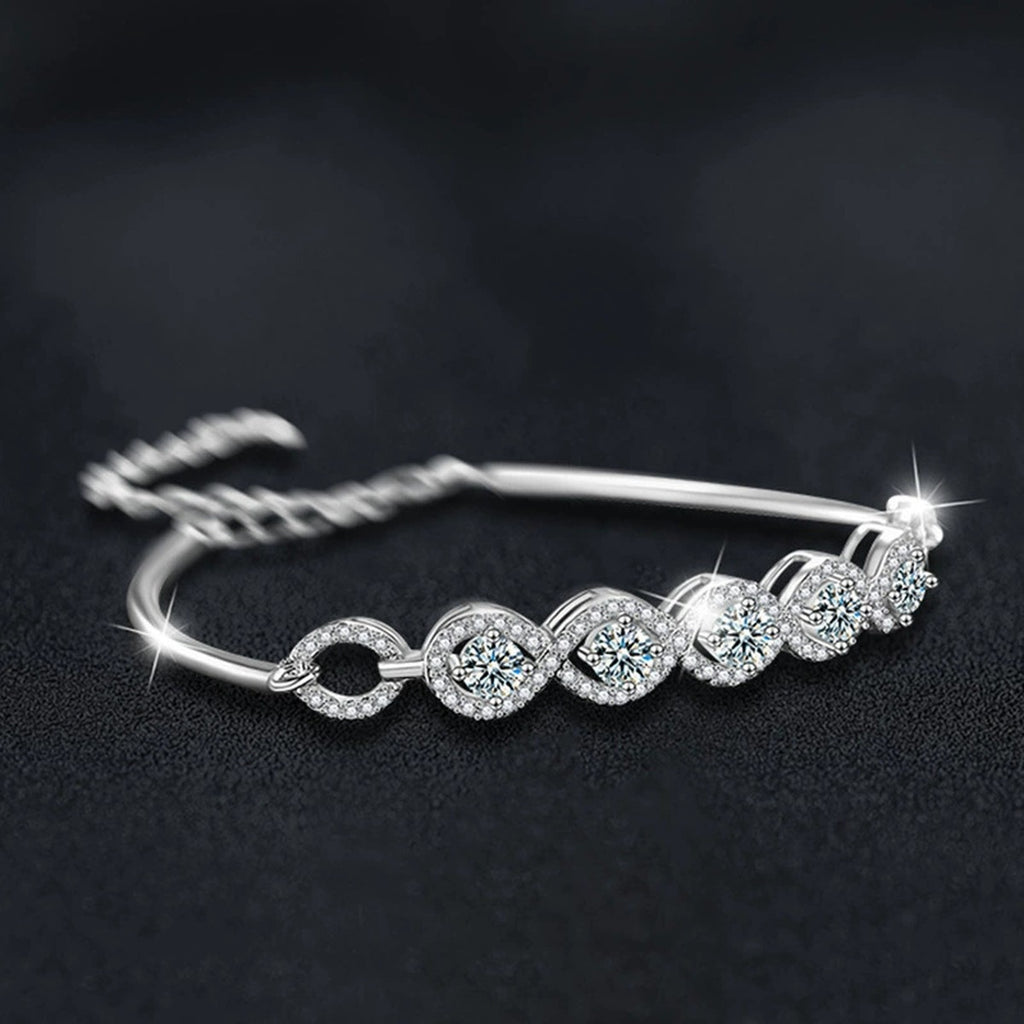 Five-Stone Round Moissanite Bangle Bracelet with CZ in White Gold-Plated S925 sterling silver angled product display showing bracelet silhouette