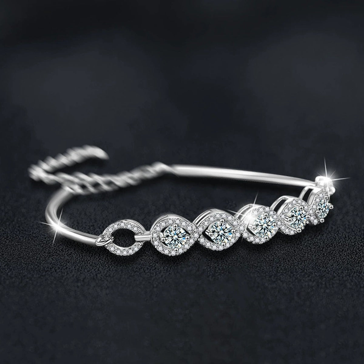Five-Stone Round Moissanite Bangle Bracelet with CZ in White Gold-Plated S925 sterling silver angled product display showing bracelet silhouette