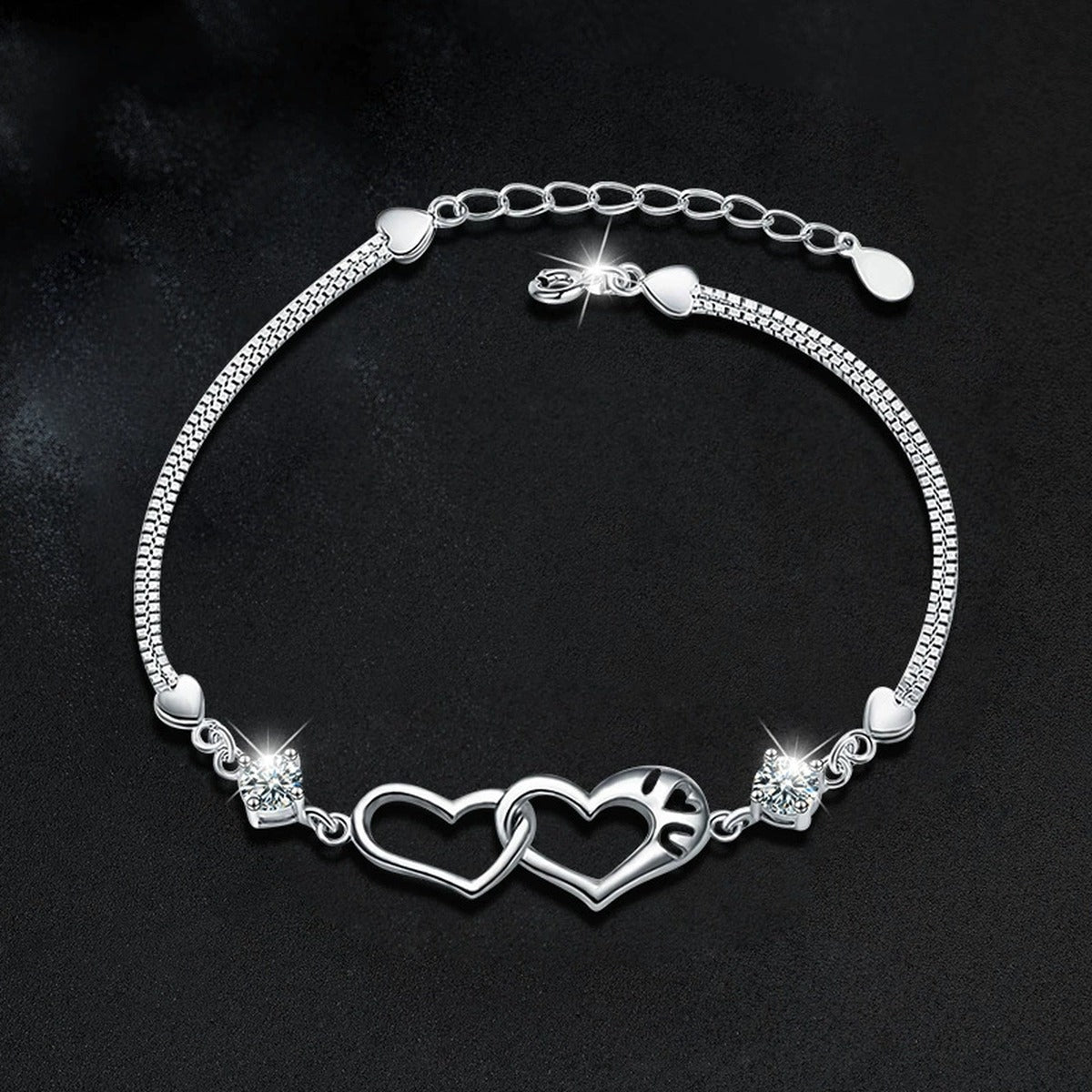 Double Heart Round Moissanite Bracelet in White Gold-Plated S925 sterling silver angled product display showing bracelet silhouette