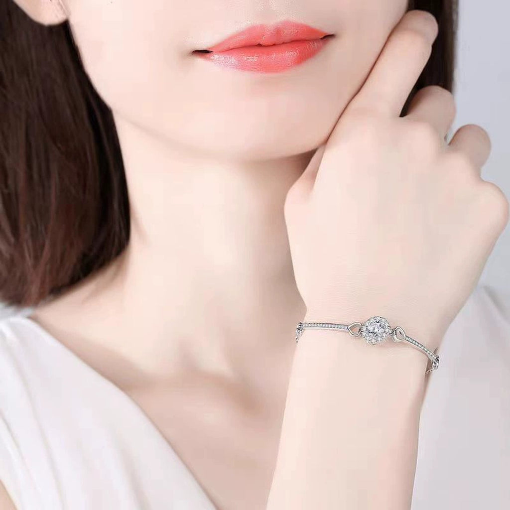 Sunflower Round Moissanite Bracelet with CZ in White Gold-Plated S925 sterling silver worn on wrist model view showing scale and adjustable fit