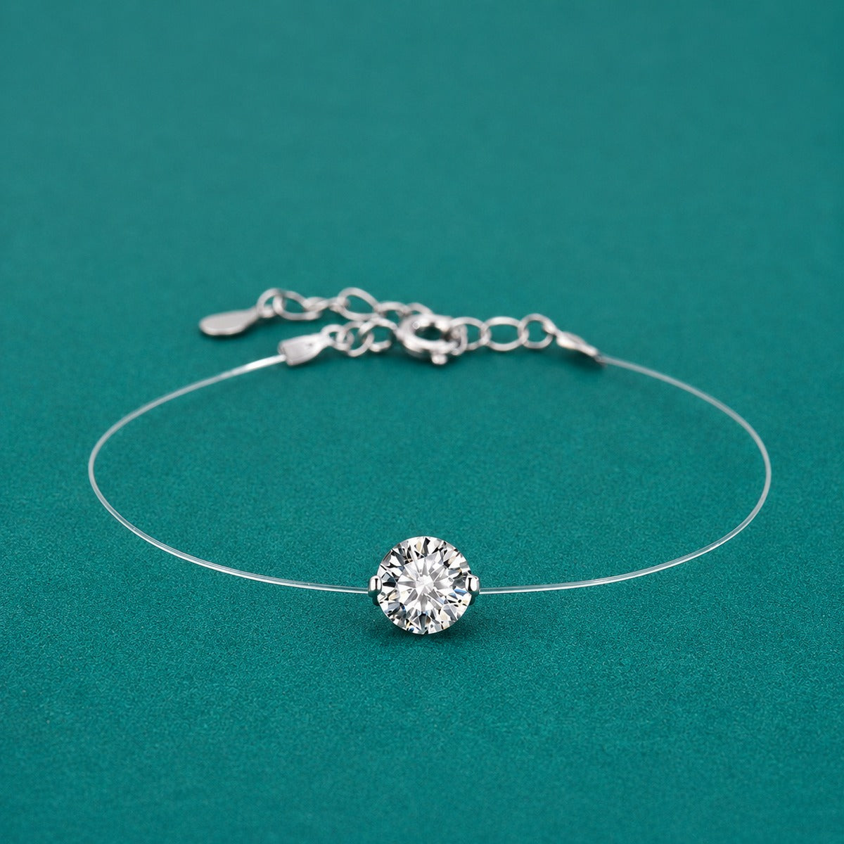 Round Moissanite Invisible Chain Bracelet in White Gold-Plated S925 sterling silver styled product scene showing stone sparkle and chain detail