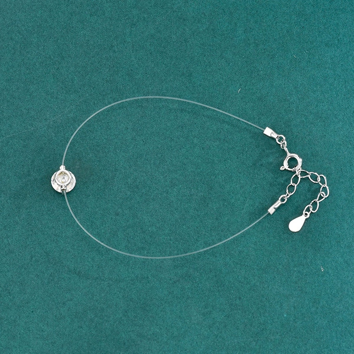 Round Moissanite Invisible Chain Bracelet in White Gold-Plated S925 sterling silver close-up bracelet detail view showing clasp and motif