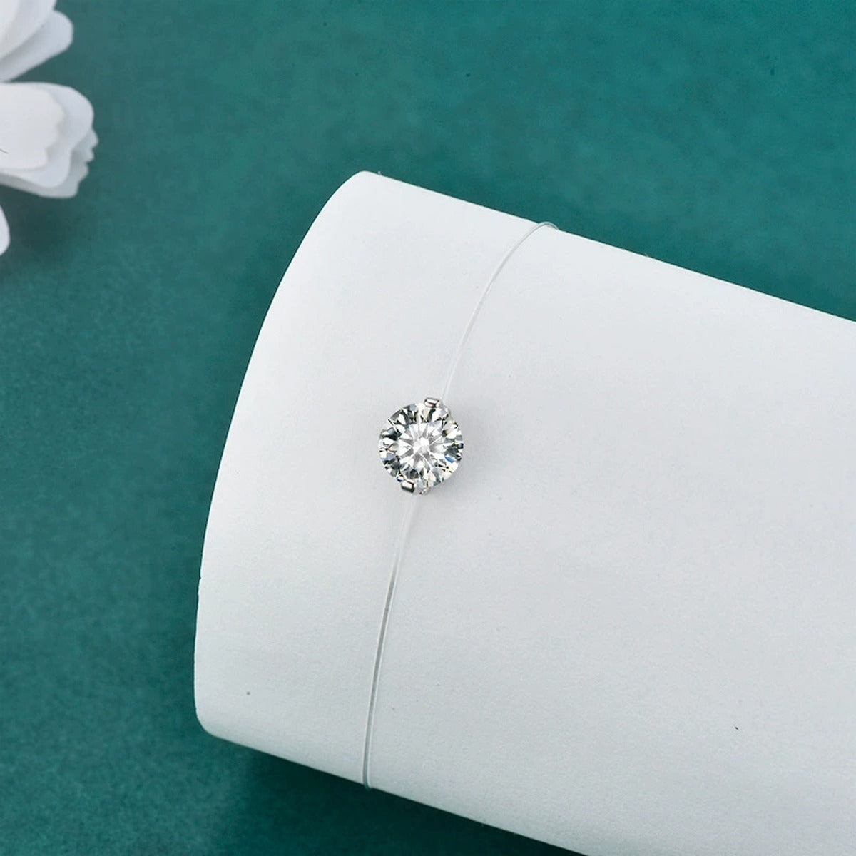 Round Moissanite Invisible Chain Bracelet in White Gold-Plated S925 sterling silver angled product display showing bracelet silhouette