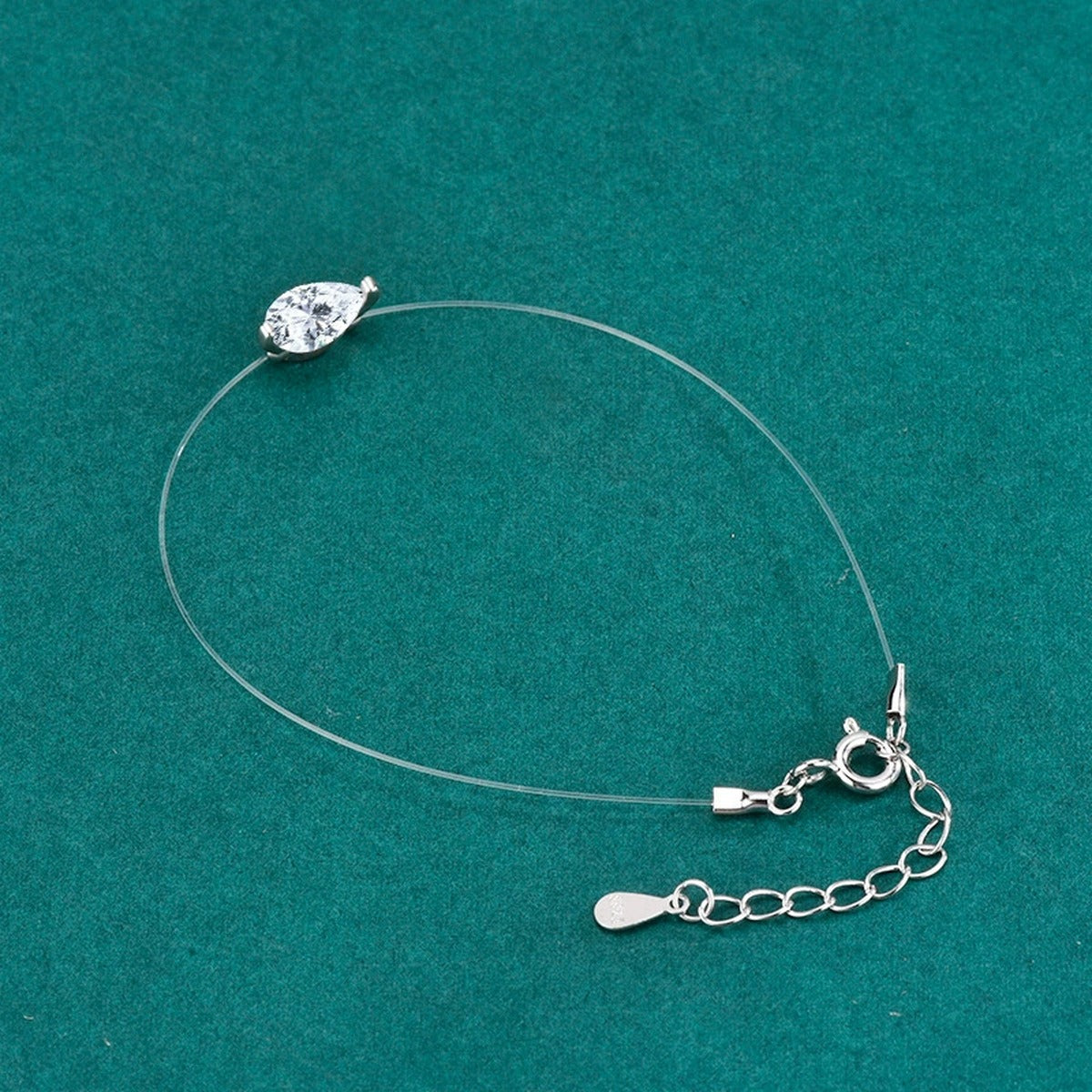 Pear-Cut Moissanite Invisible Chain Bracelet in White Gold-Plated S925 sterling silver angled product display showing bracelet silhouette