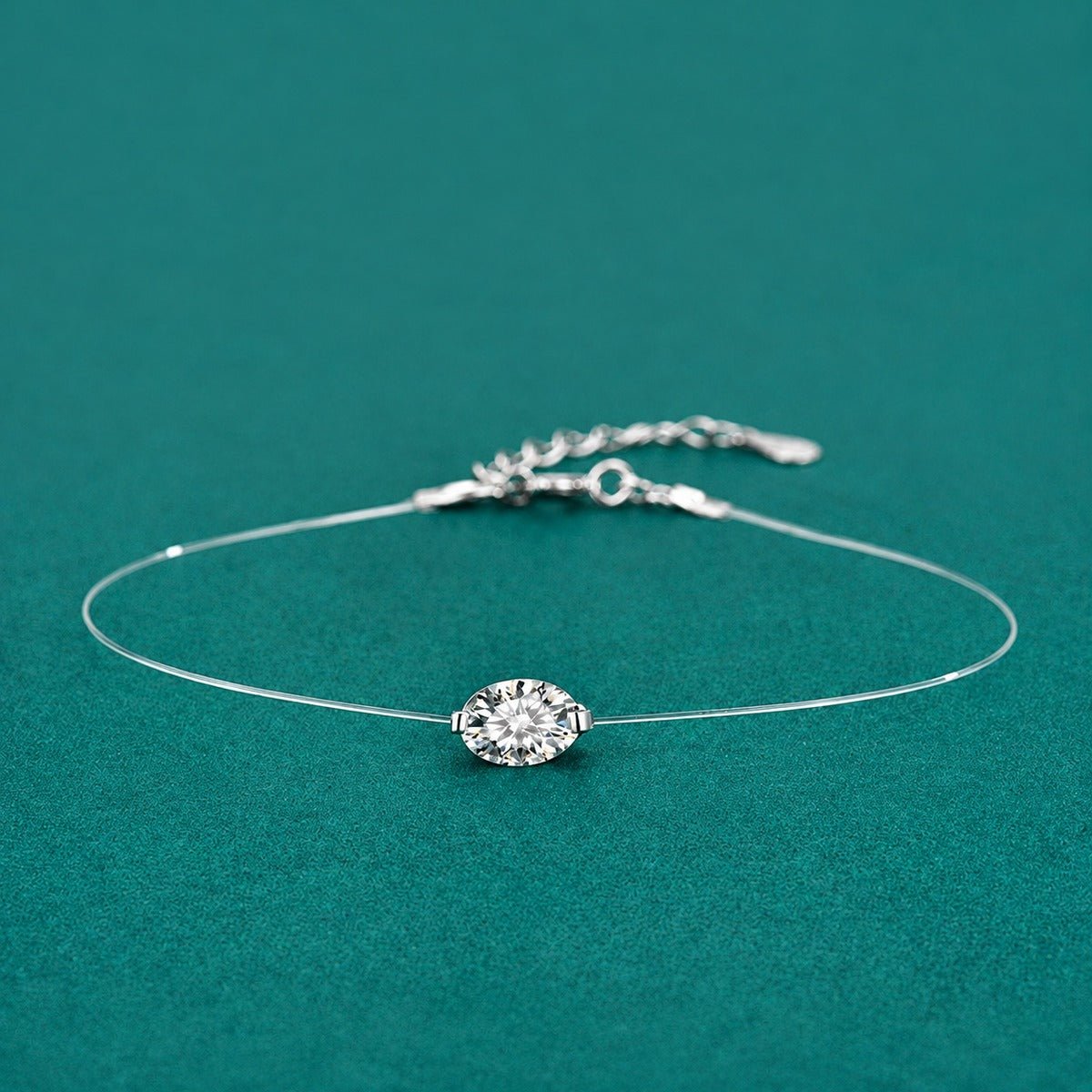 Oval-Cut Moissanite Invisible Chain Bracelet in White Gold-Plated S925 sterling silver styled product scene showing stone sparkle and chain detail