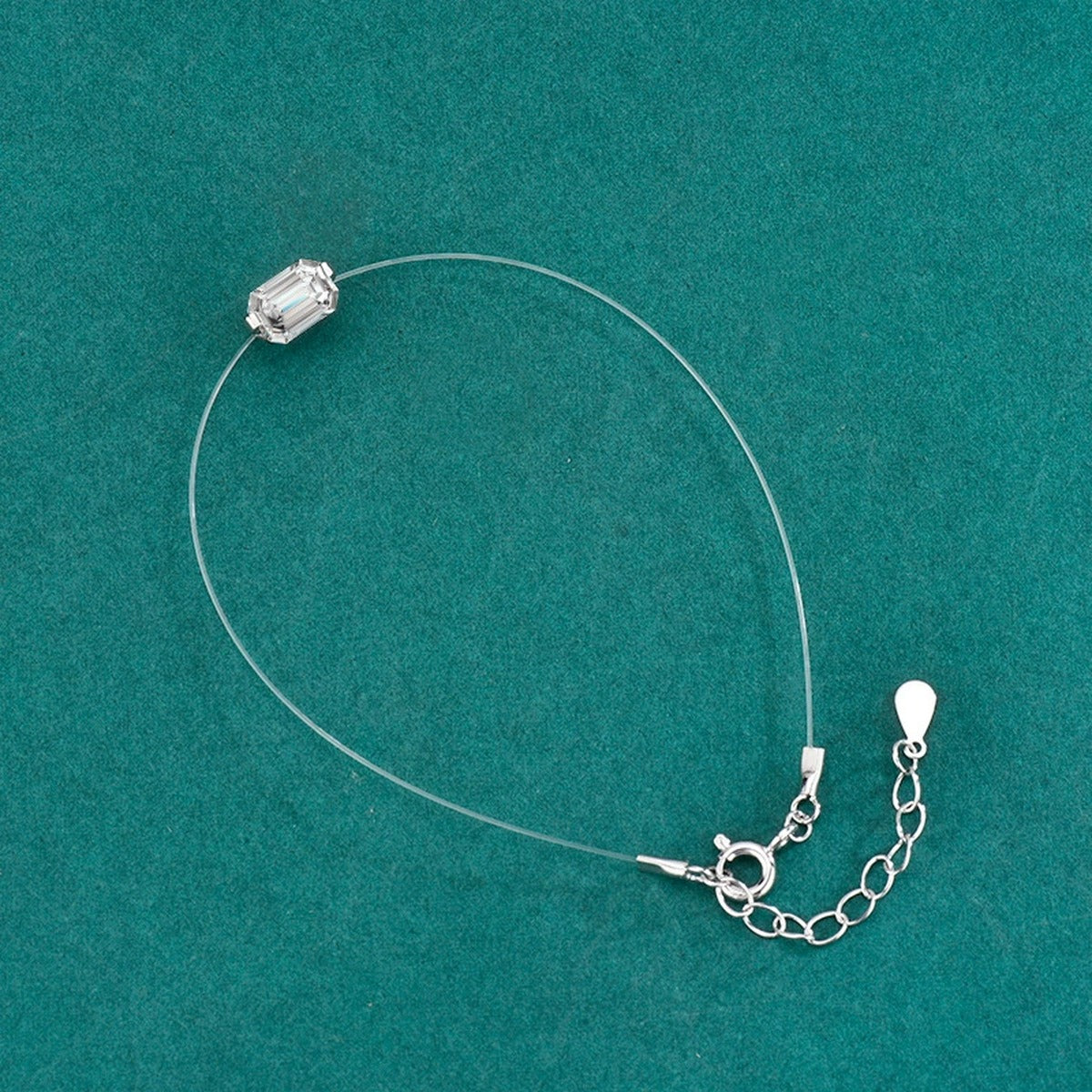 Emerald or Radiant-Cut Moissanite Invisible Chain Bracelet in White Gold-Plated S925 sterling silver angled product display showing bracelet silhouette